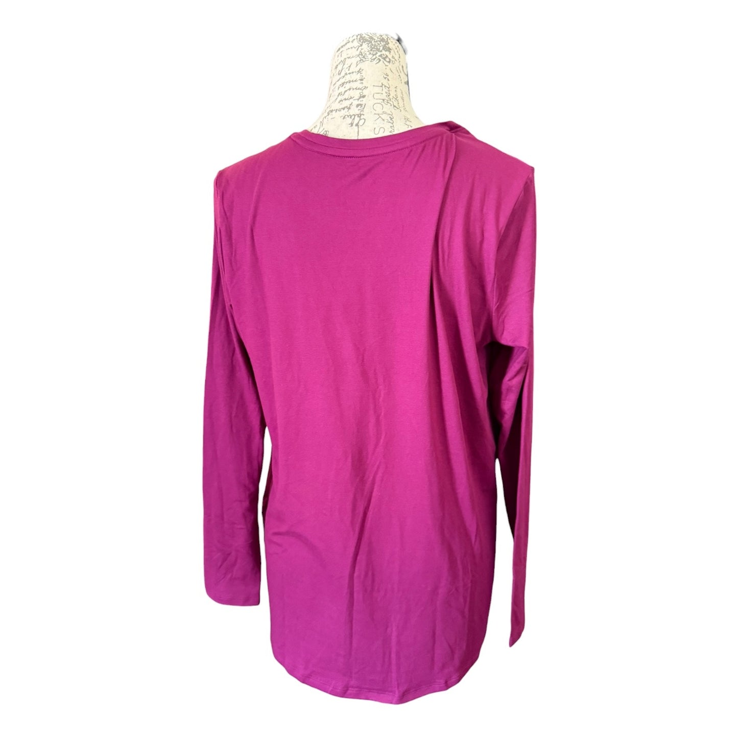 A purple long-sleeve t-shirt displayed on a vintage-style mannequin torso against a plain white background.