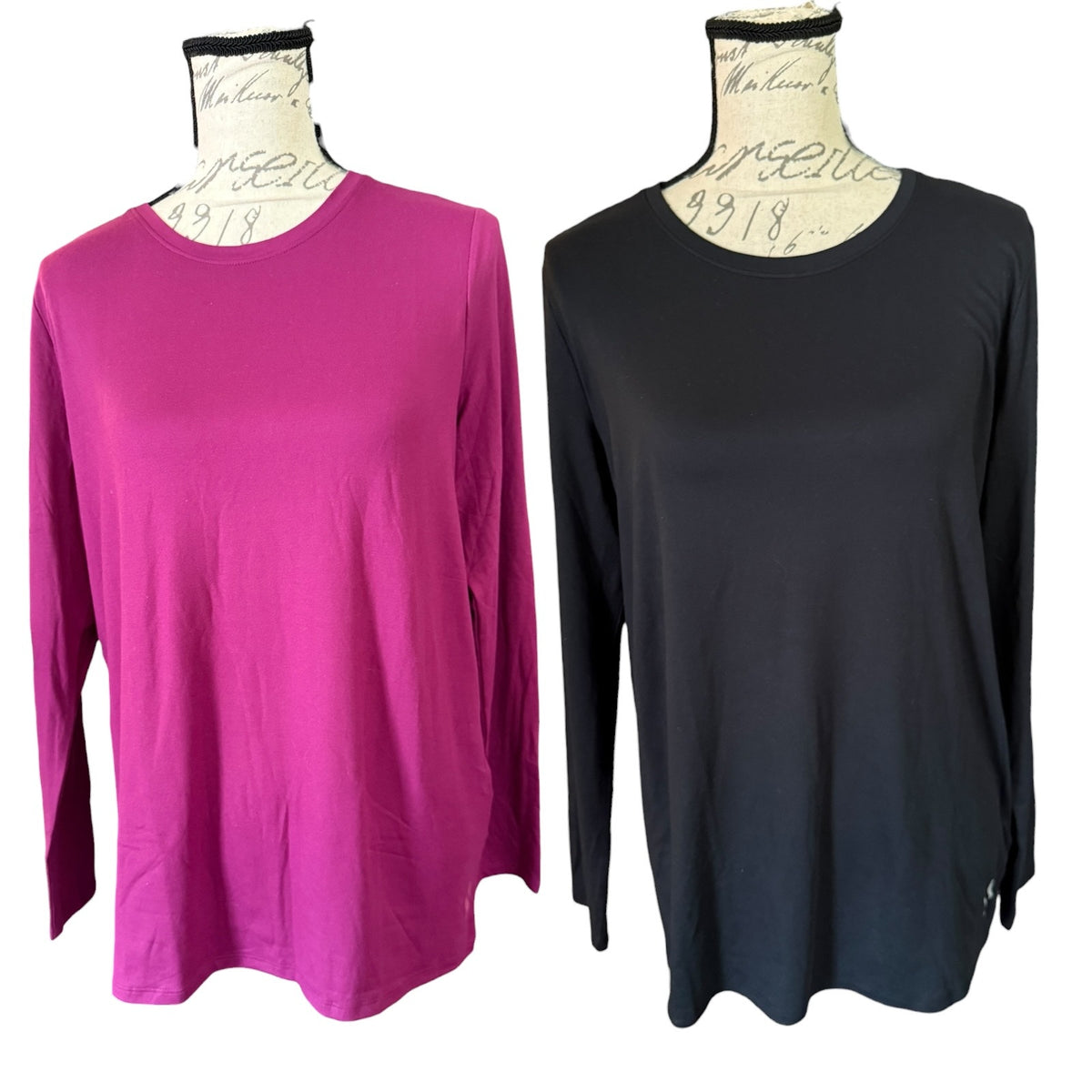 Two long-sleeve crewneck tops displayed on dress forms against a white background.