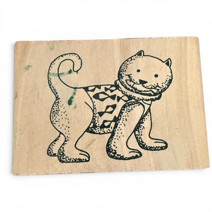 Wooden stamp with a cat design on a white background