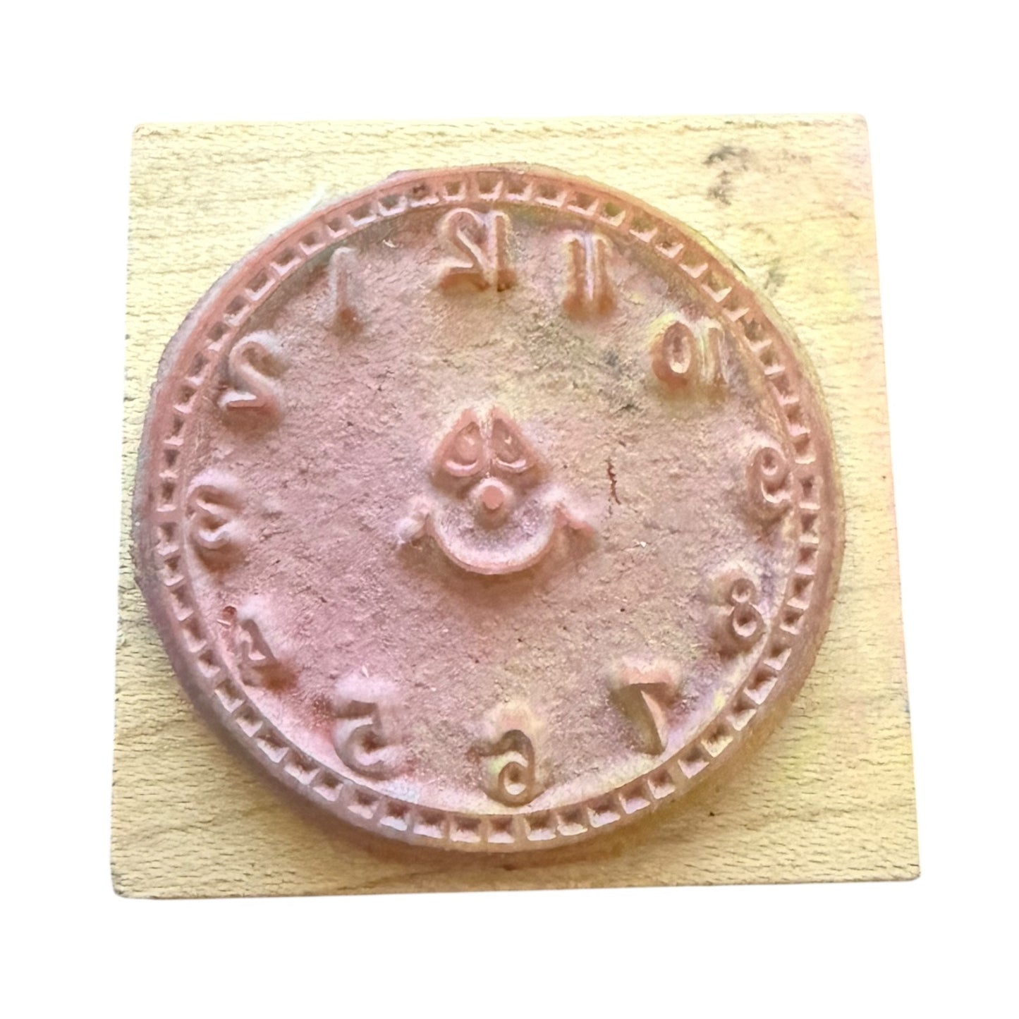 Rubber stamp with clock design on a wooden block