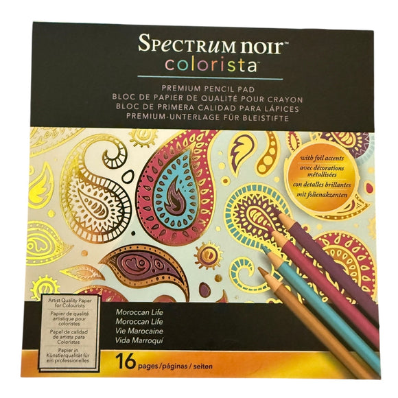Spectrum Noir Colorista coloring book with paisley designs and colored pencils on a white background