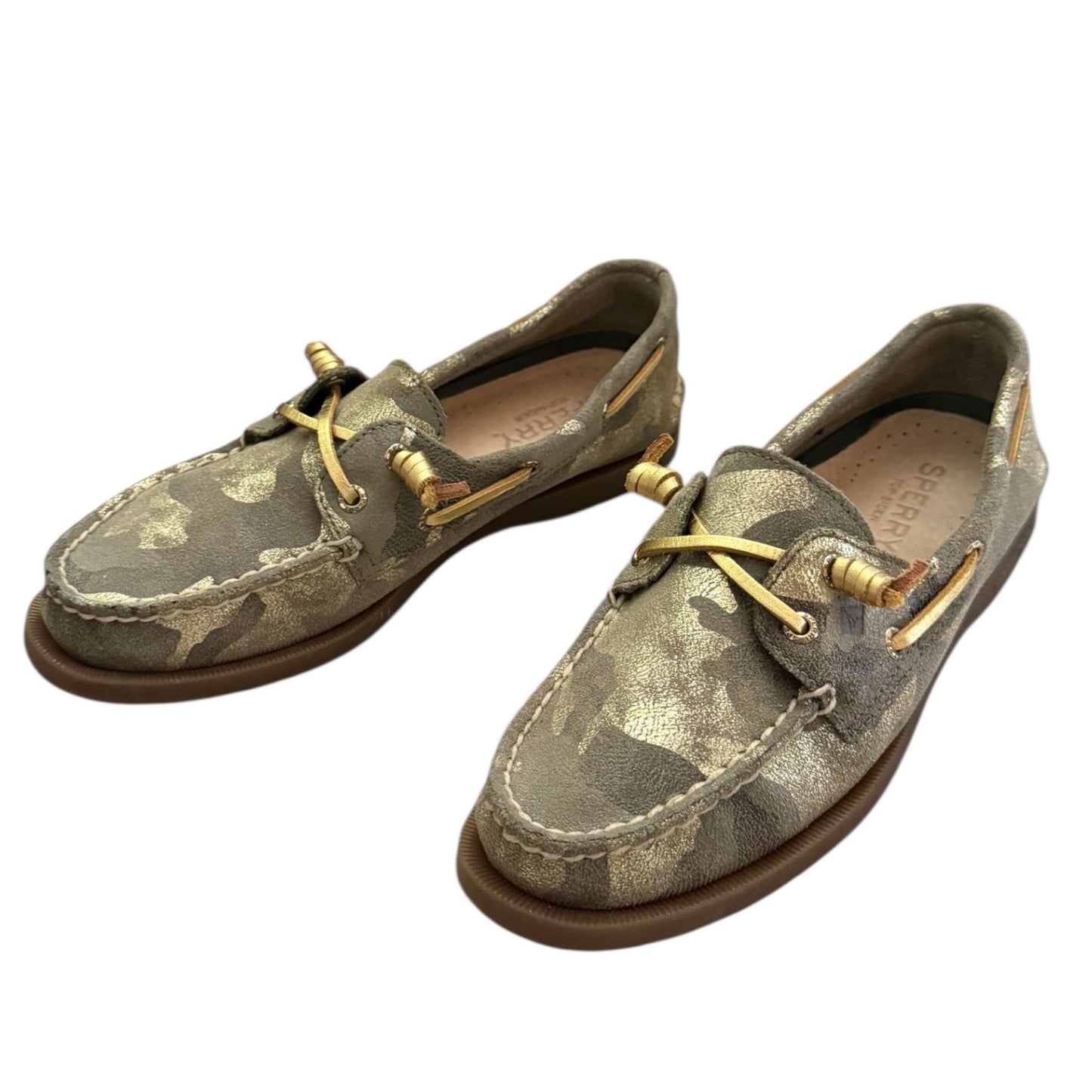 Front side Pair of camouflage-patterned boat shoes with gold laces on a white background