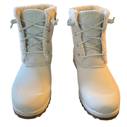 Front of winter boots with fur lining on a white background