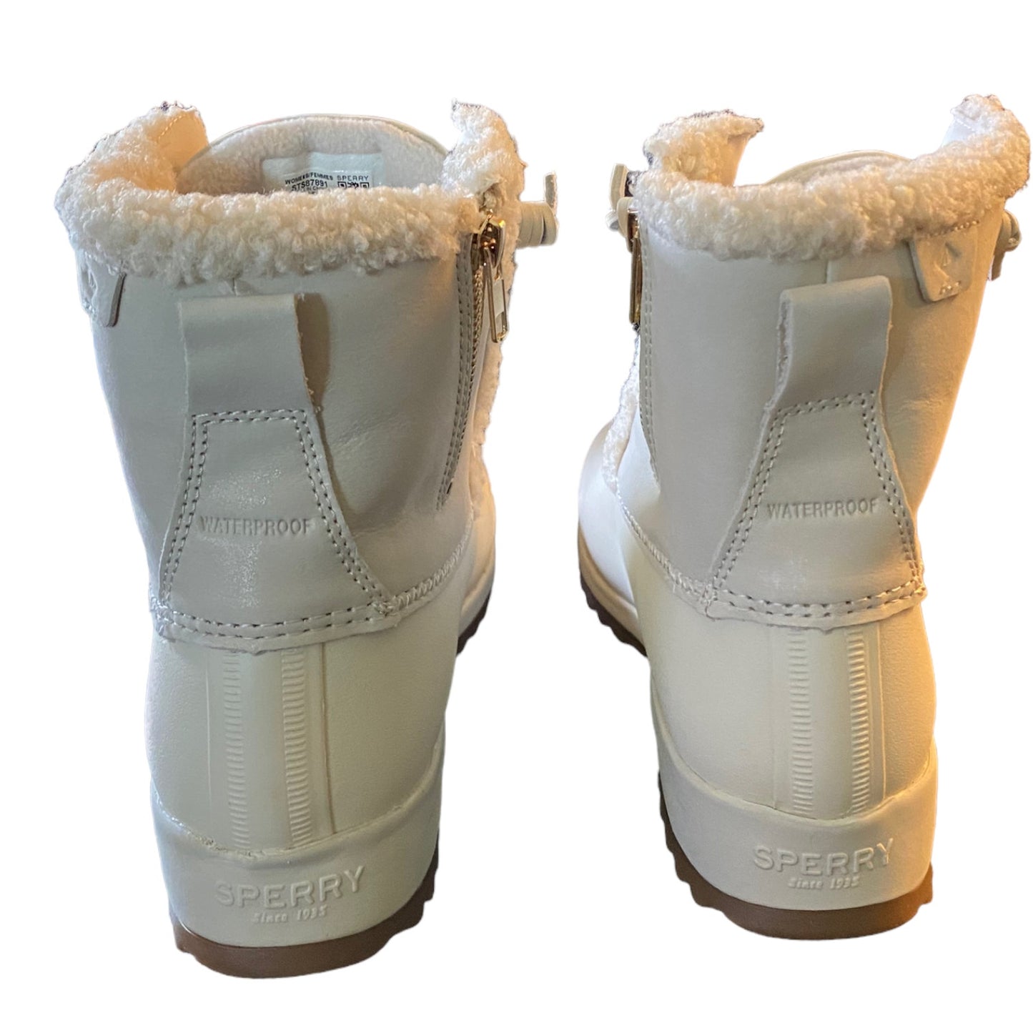 Back of  Sperry boots with fur lining on a white background
