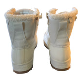 Back of  Sperry boots with fur lining on a white background