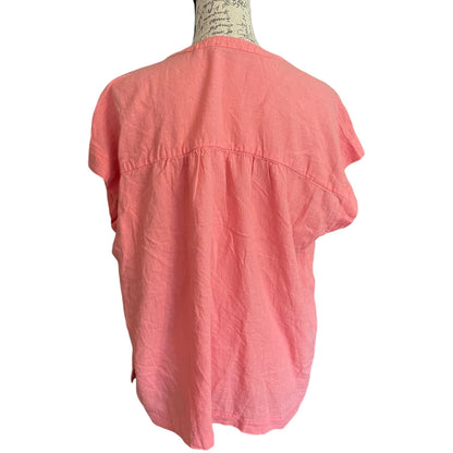 Back of Coral shirt on a mannequin against a white background