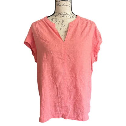 Front of Coral pink blouse on a mannequin with a white background