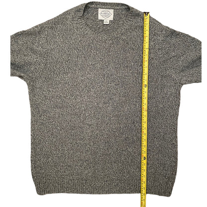 Gray textured sweater with a measuring tape on a white background