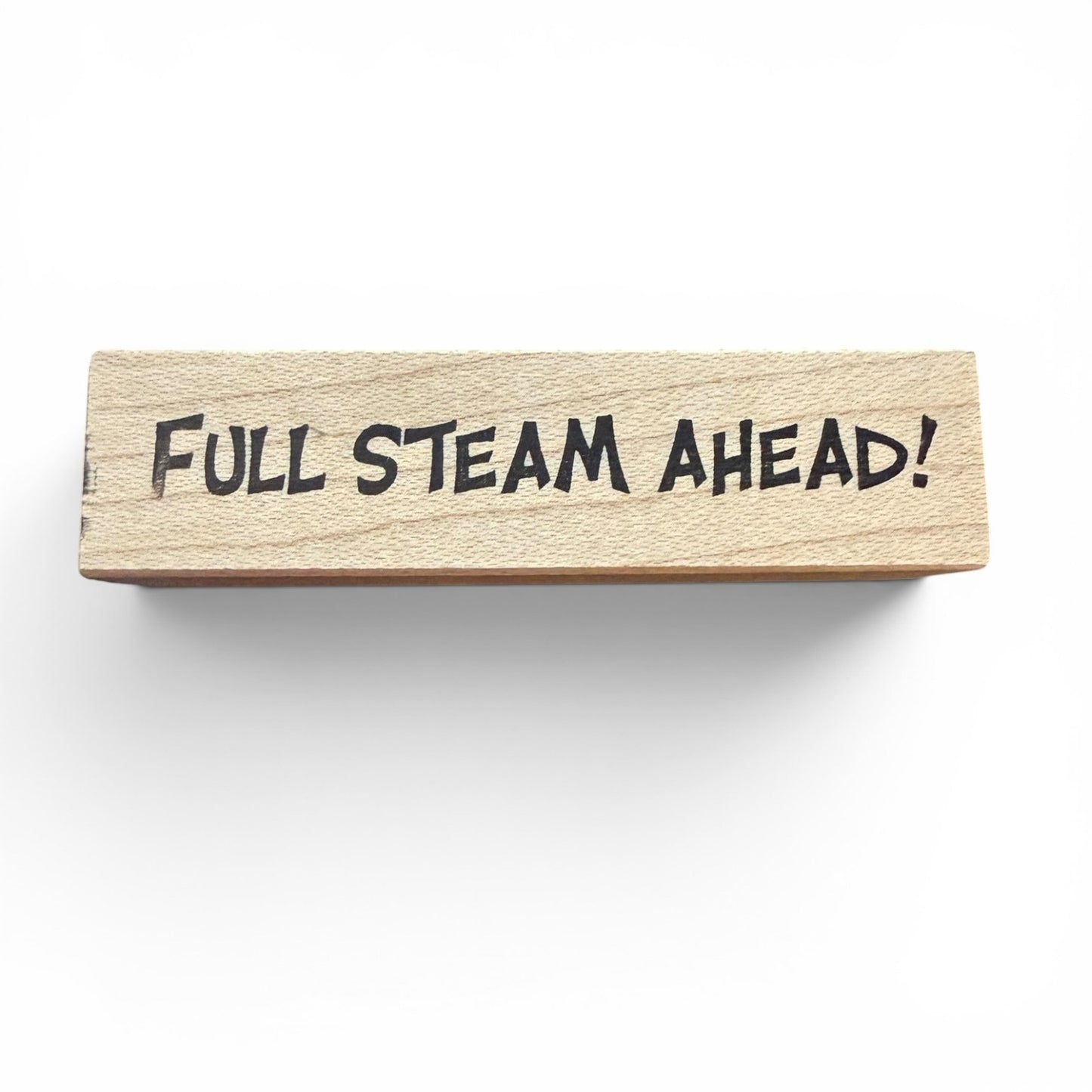 Wooden block with 'Full Steam Ahead!' text on a white background