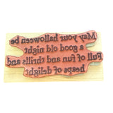 Wooden stamp with engraved text on a wooden background