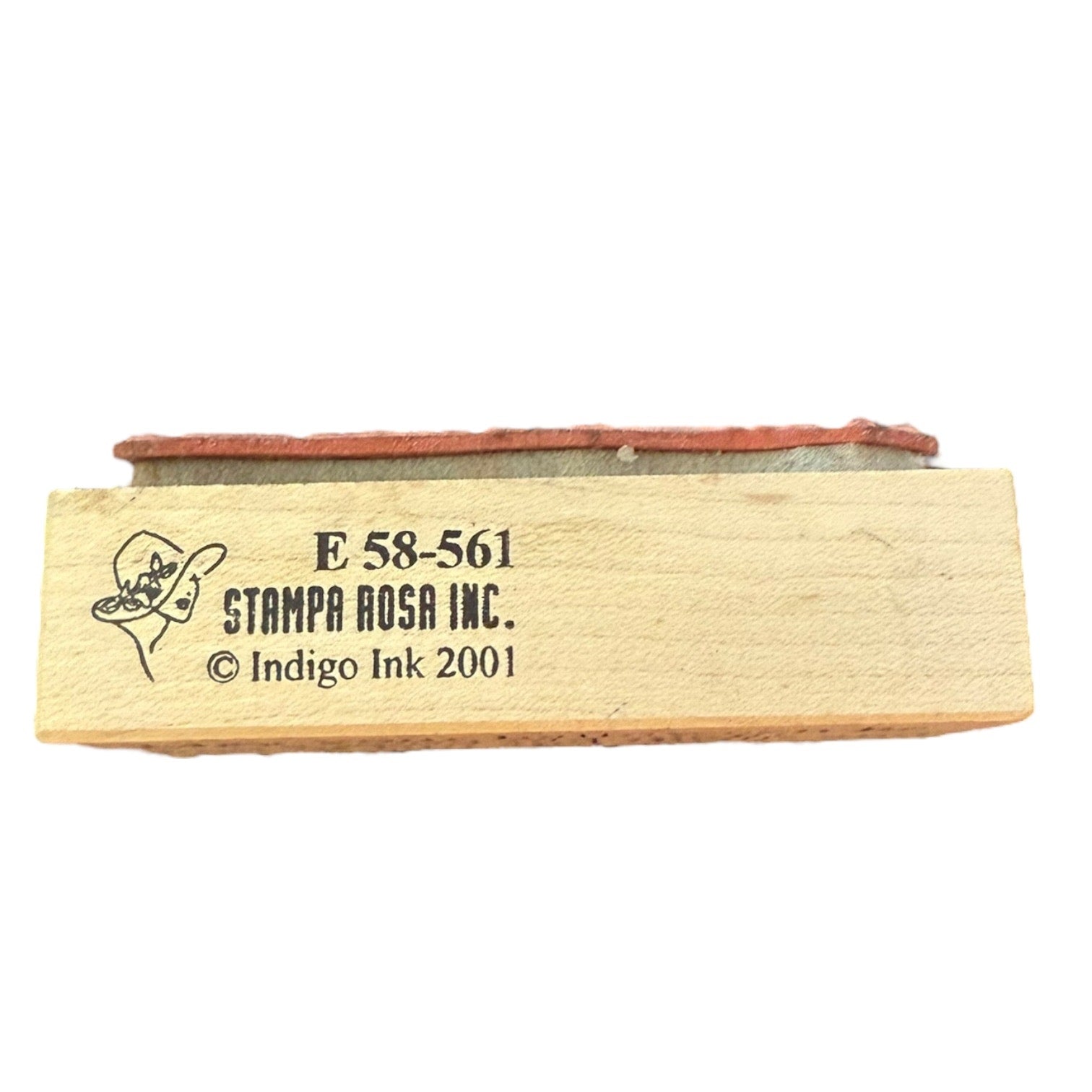 Wooden stamp with 'Stampa Rosa Inc.' branding on a white background