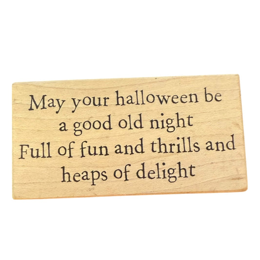 Wooden stamp with Halloween message on a white background