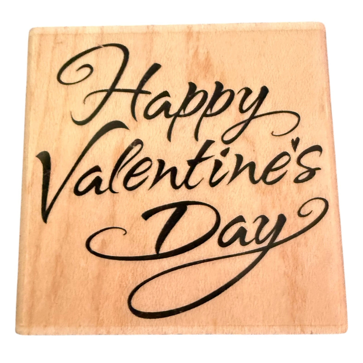 A square wooden stamp with the phrase 'Happy Valentine's Day' written in black cursive script, shown on a plain white background.