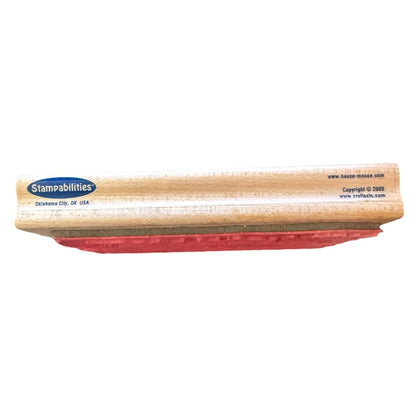 A Stampabilities stamping with a light wood handle and a red metal stamping bed, shown against a plain white background.
