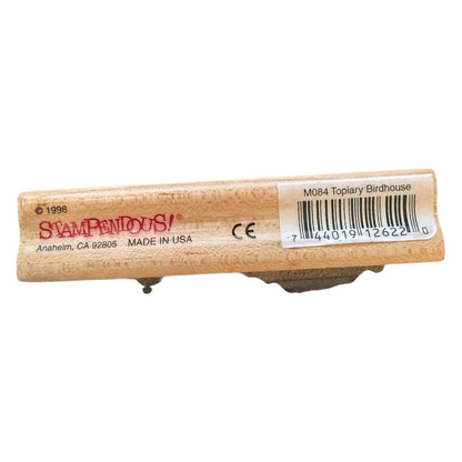 Wooden stamp with 'Stampendous!' branding on a white background