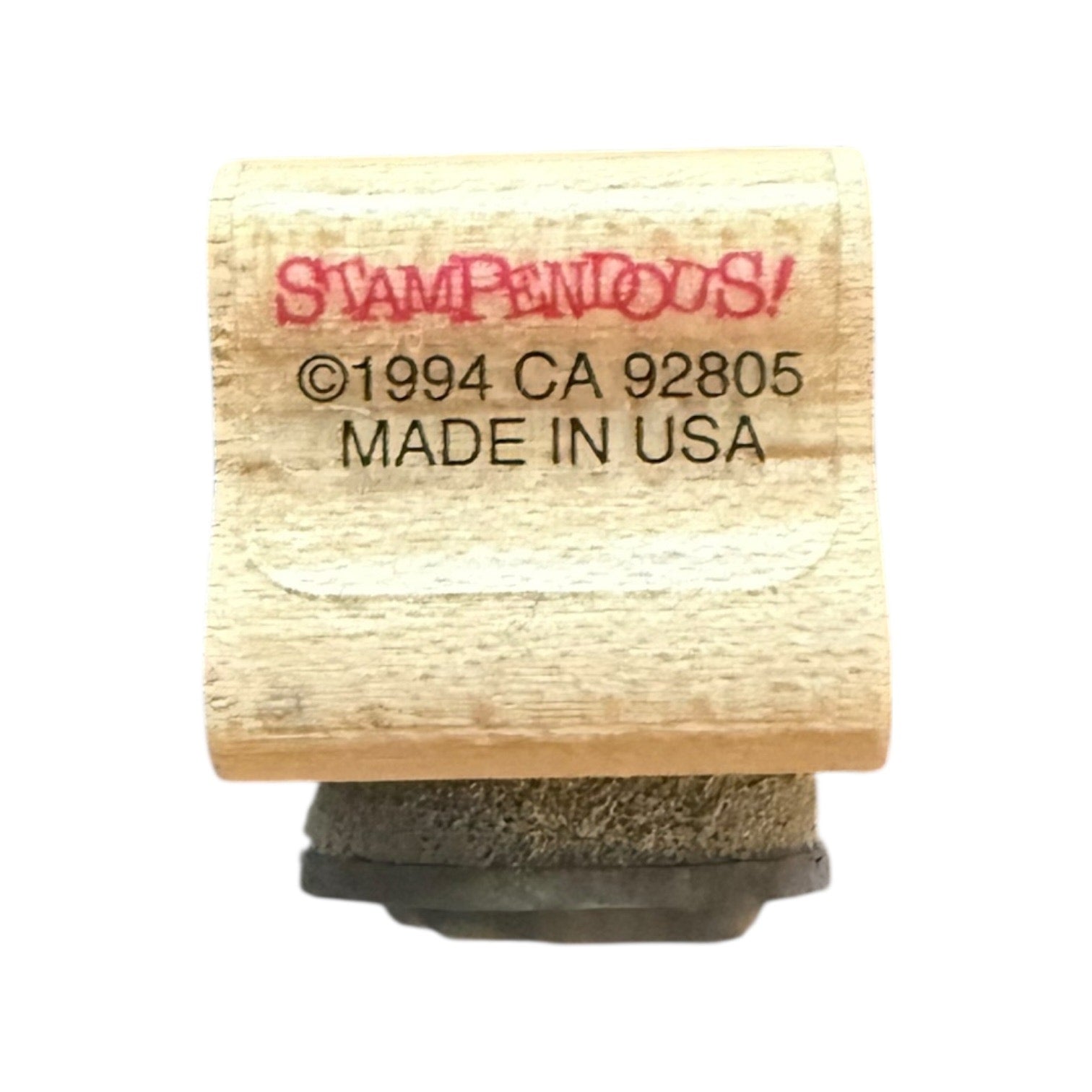 Wooden stamp with 'Stampendous!' branding and text on a white background
