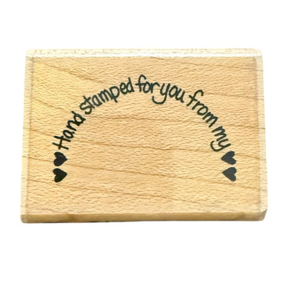 A rectangular wooden block with  black text reading 'Hand stamped for you from my' and small heart motifs on both sides, shown on a plain white background.