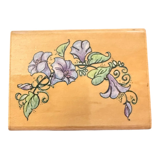 Wooden block with floral design on a white background