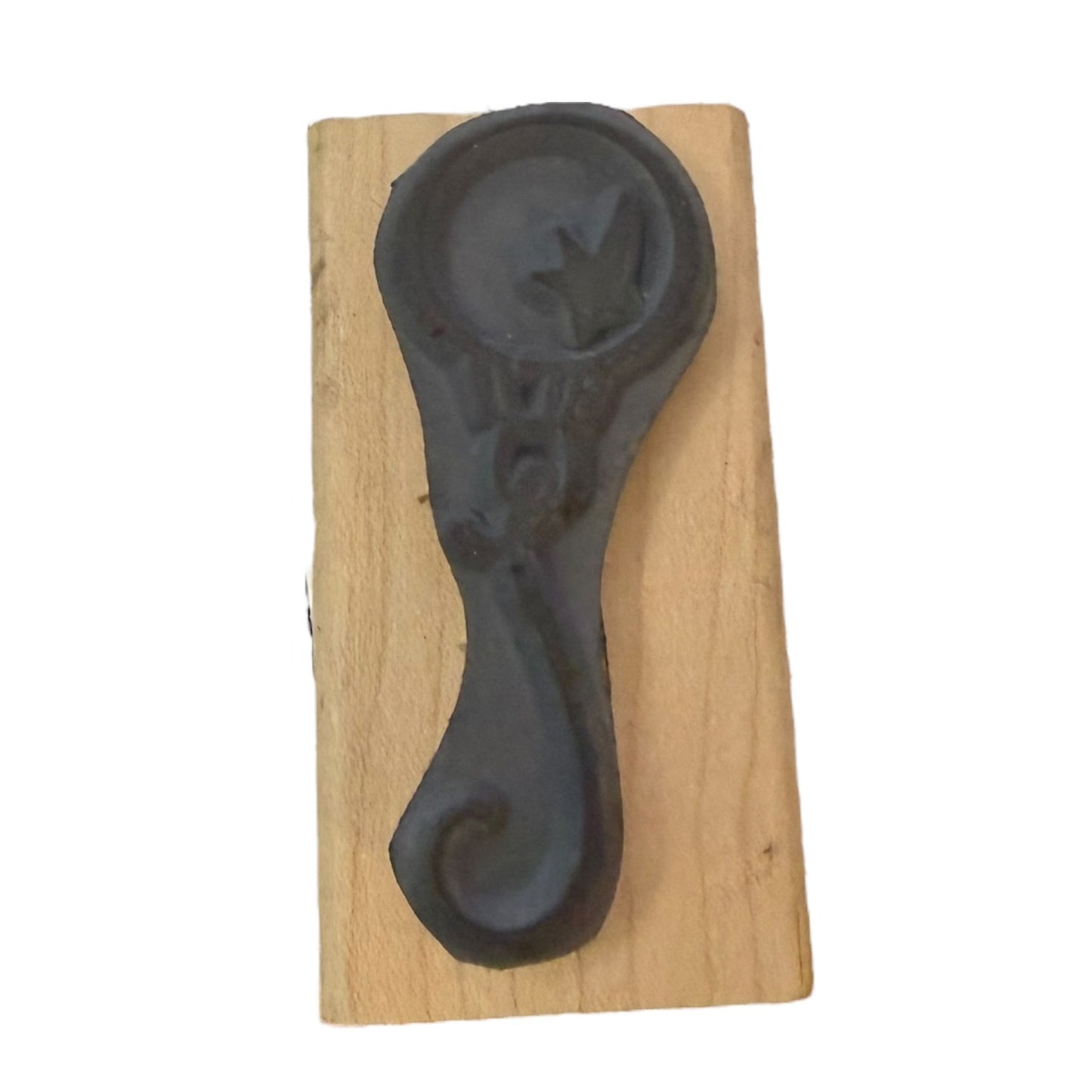 gray rubber stamp on a wooden block