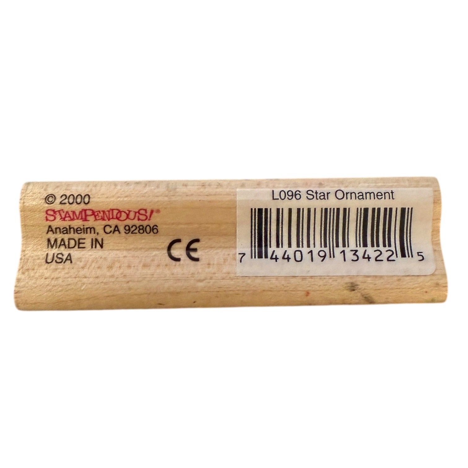 Wooden star ornament wooden block with branding and barcode on a white background