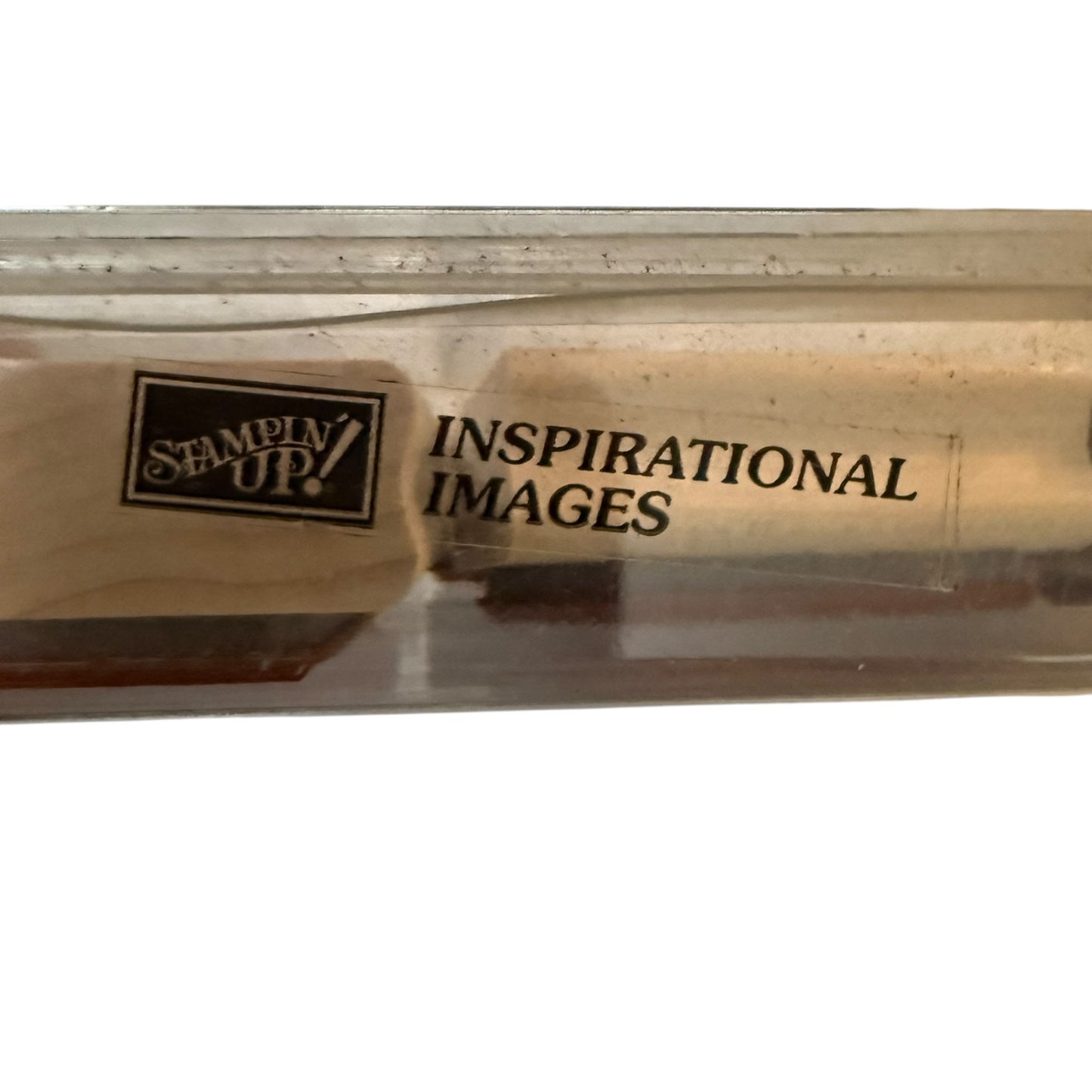 Wooden stamp with 'Stampin' Up!' and 'Inspirational Images' text on a clear background