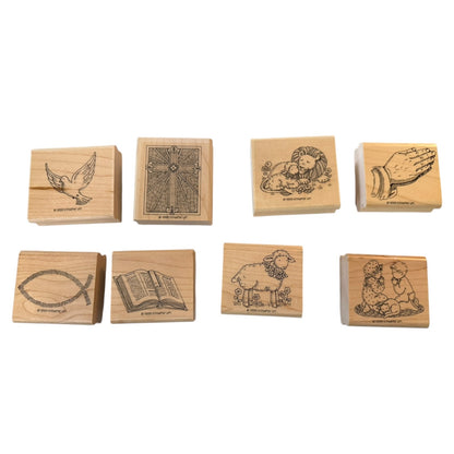 Set of eight wooden stamps with various religious designs on a white background