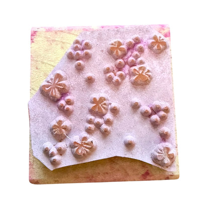 Rubber stamp with dots and butterflies on a white background