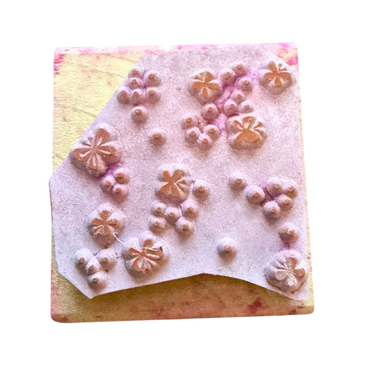 Rubber stamp with dots and butterflies on a white background