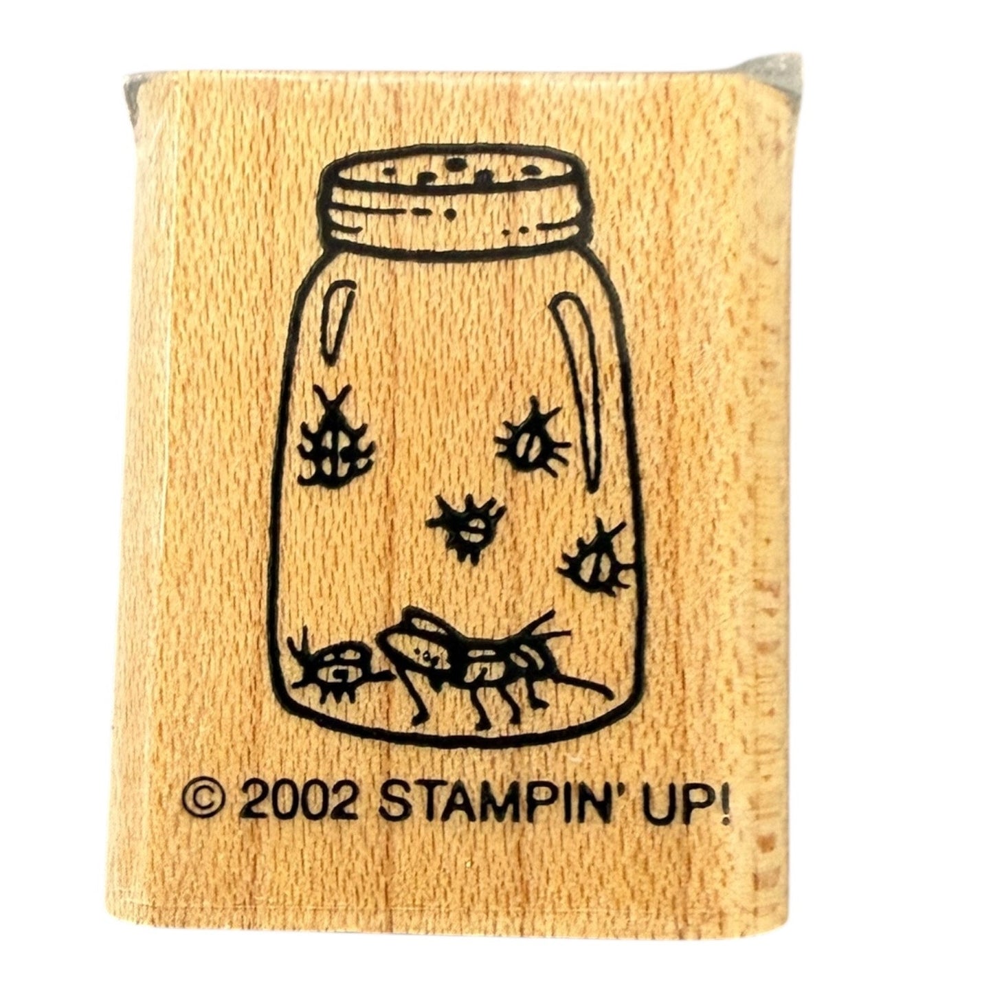 Wooden stamp with a design of a jar with bugs and 'Stampin' Up!' branding.