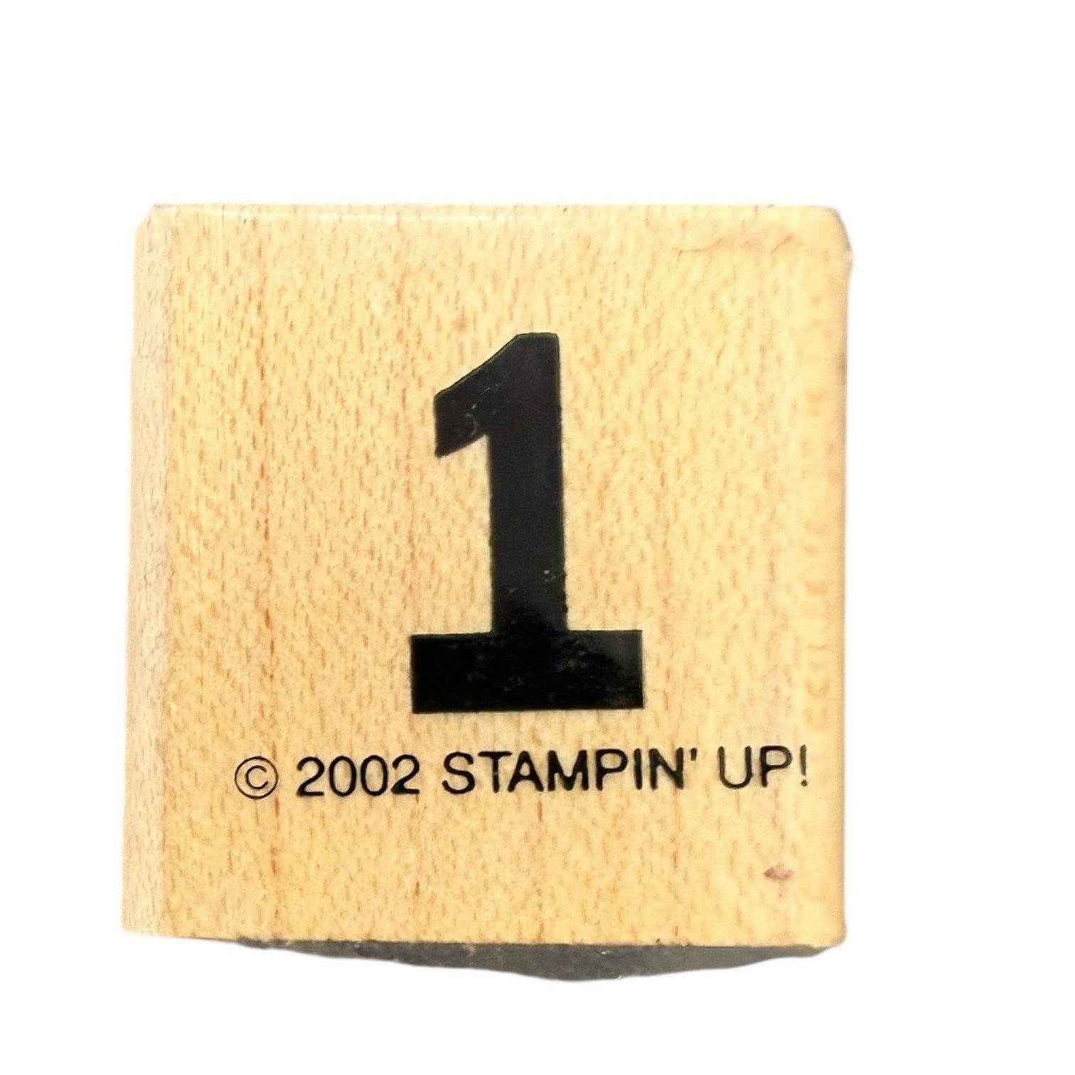 Rubber stamp with the number '1' and '2002 Stampin' Up!' text on a white background