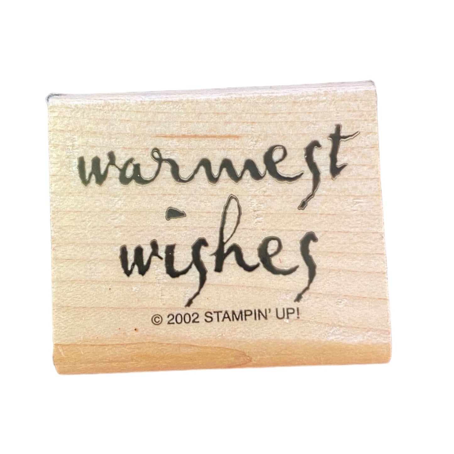 Wooden stamp with 'warmest wishes' text and 'Stampin' Up!' branding on a white background
