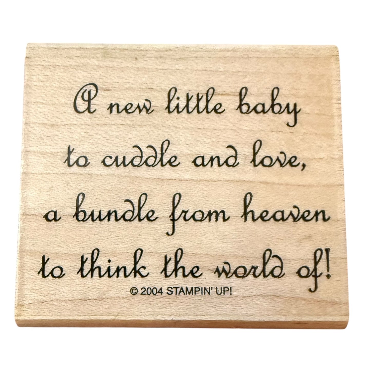 Wooden stamp block with text 'A new little baby to cuddle and love, a bundle from heaven to think the world of!' by Stampin' Up!.