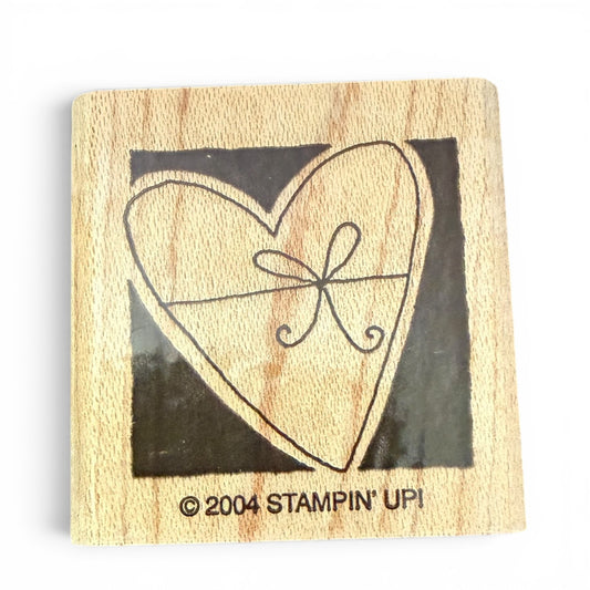 Wooden stamp with heart design and 'Stampin' Up!' branding on a white background
