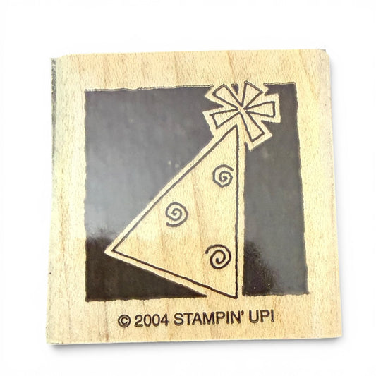 Wooden stamp with party design and '2004 Stampin' Up!' branding on a white background