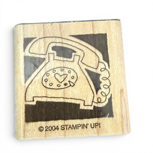 Rubber stamp with a vintage phone design on a wooden block, featuring the 'Stampin' Up!' brand.