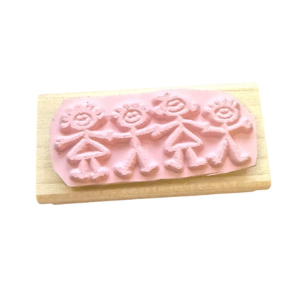 Pink rubber stamp of a stick family on a white background