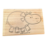Wooden stamp with a hippo design on a white background