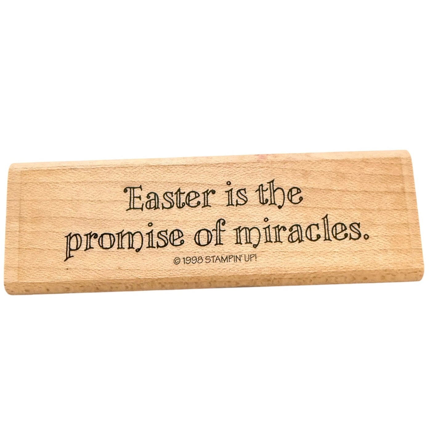 A rectangular light wood stamp with the phrase 'Easter is the promise of miracles.' and a small '© 1999 STAMPIN' UP!' copyright line, shown on a plain white background.
