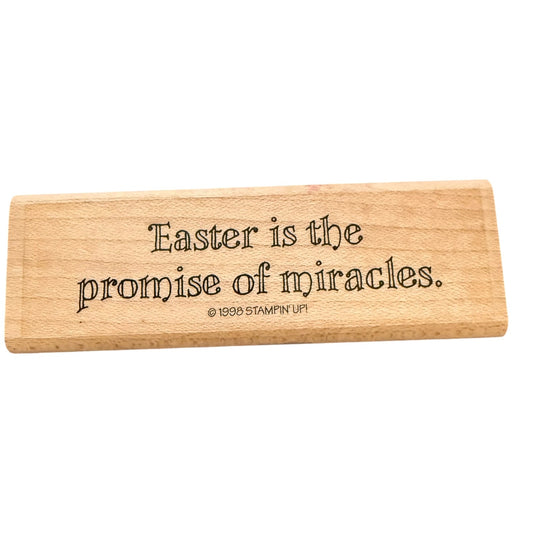A rectangular light wood stamp with the phrase 'Easter is the promise of miracles.' and a small '© 1999 STAMPIN' UP!' copyright line, shown on a plain white background.