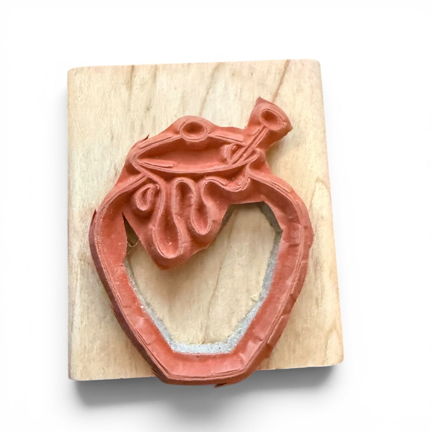 Wooden stamp with a honey pot design on a white background