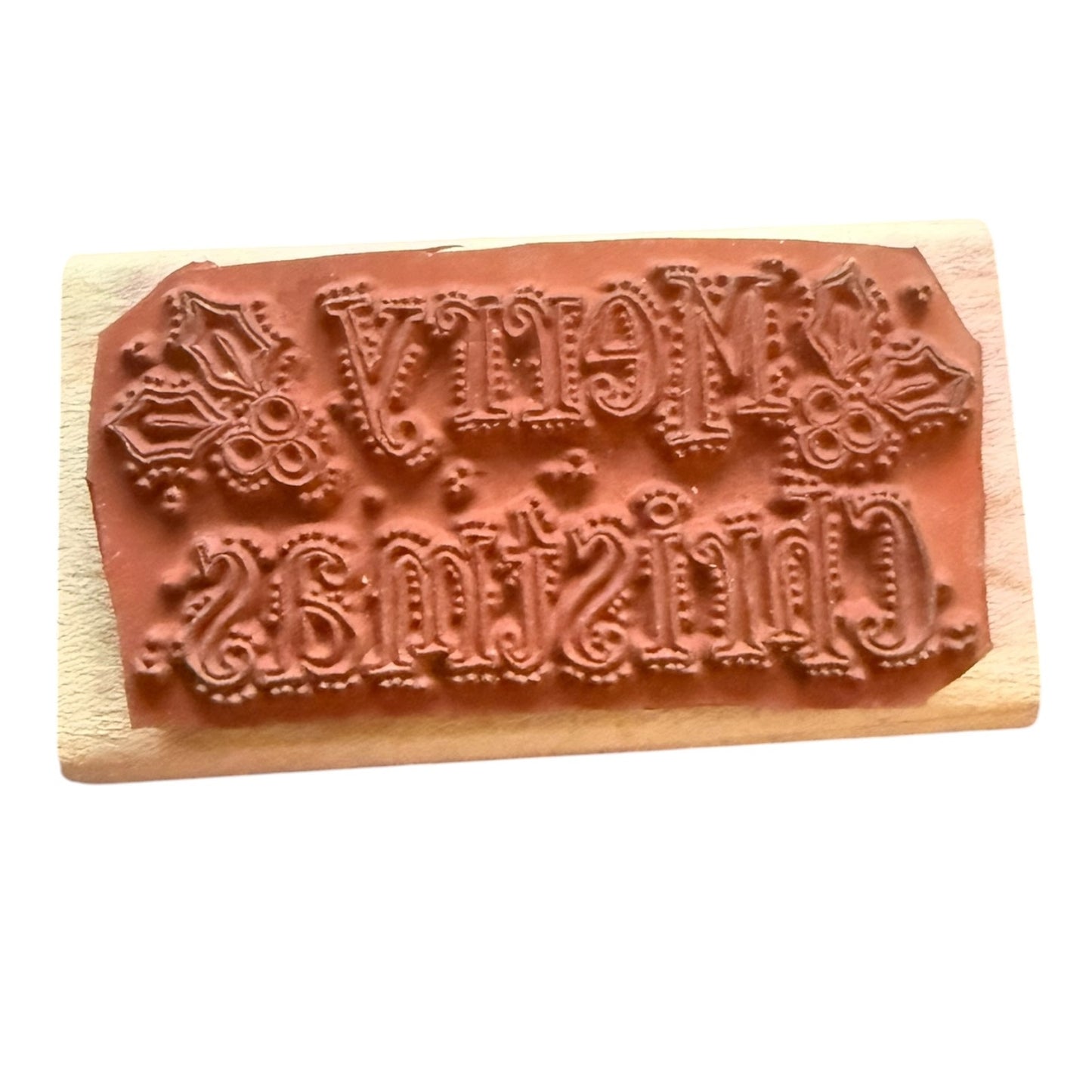 Decorative stamp with intricate designs on a wooden block