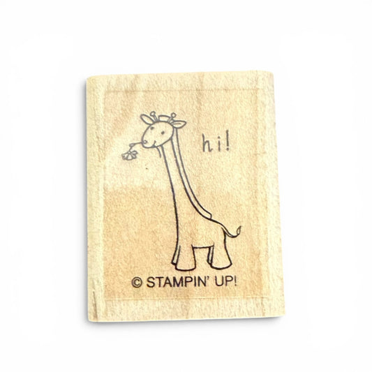 Rubber stamp with a giraffe design and 'hi!' text on a beige background, featuring the Stampin' Up! logo.