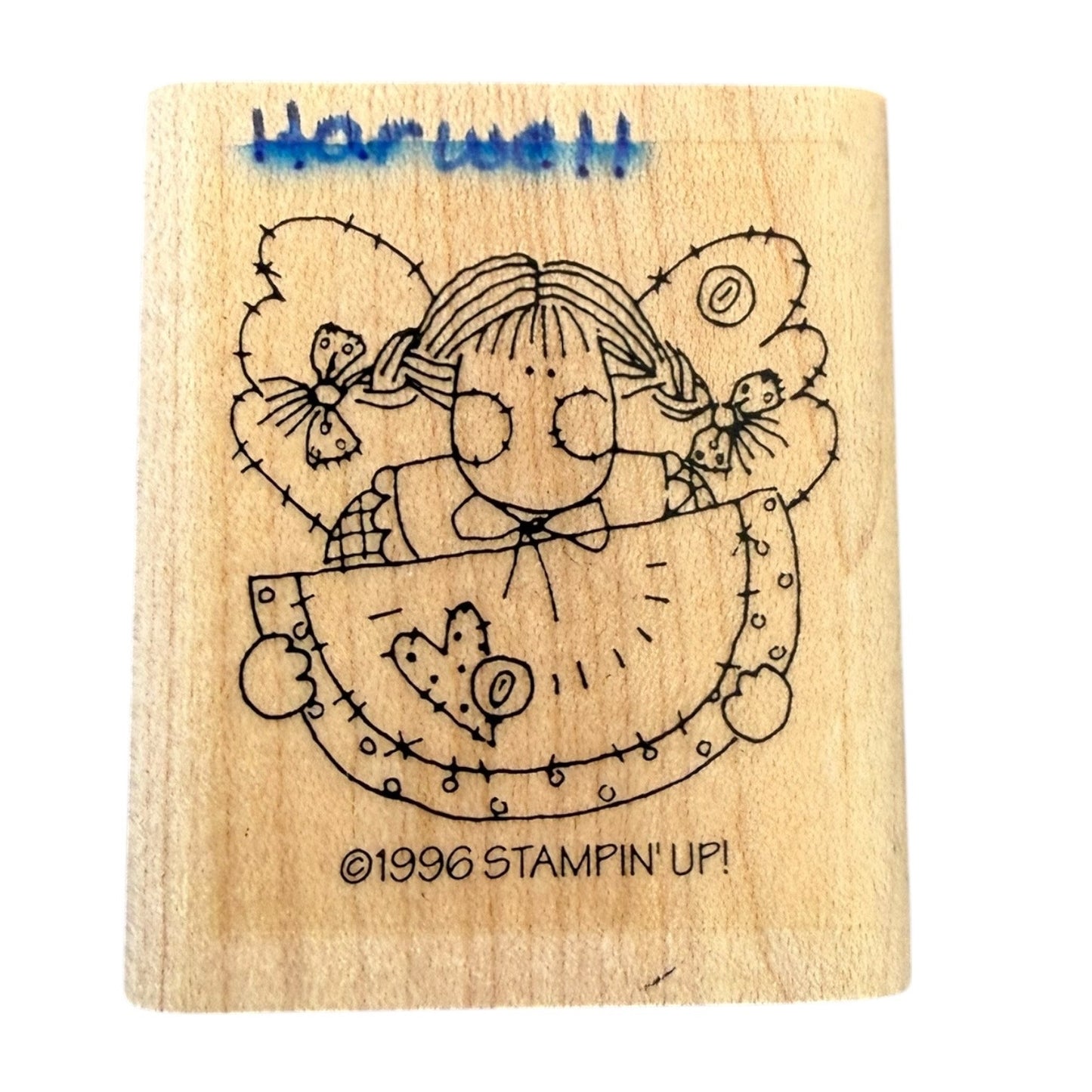 Wooden stamp with a angel design and 'Stampin' Up!' branding on a white background
