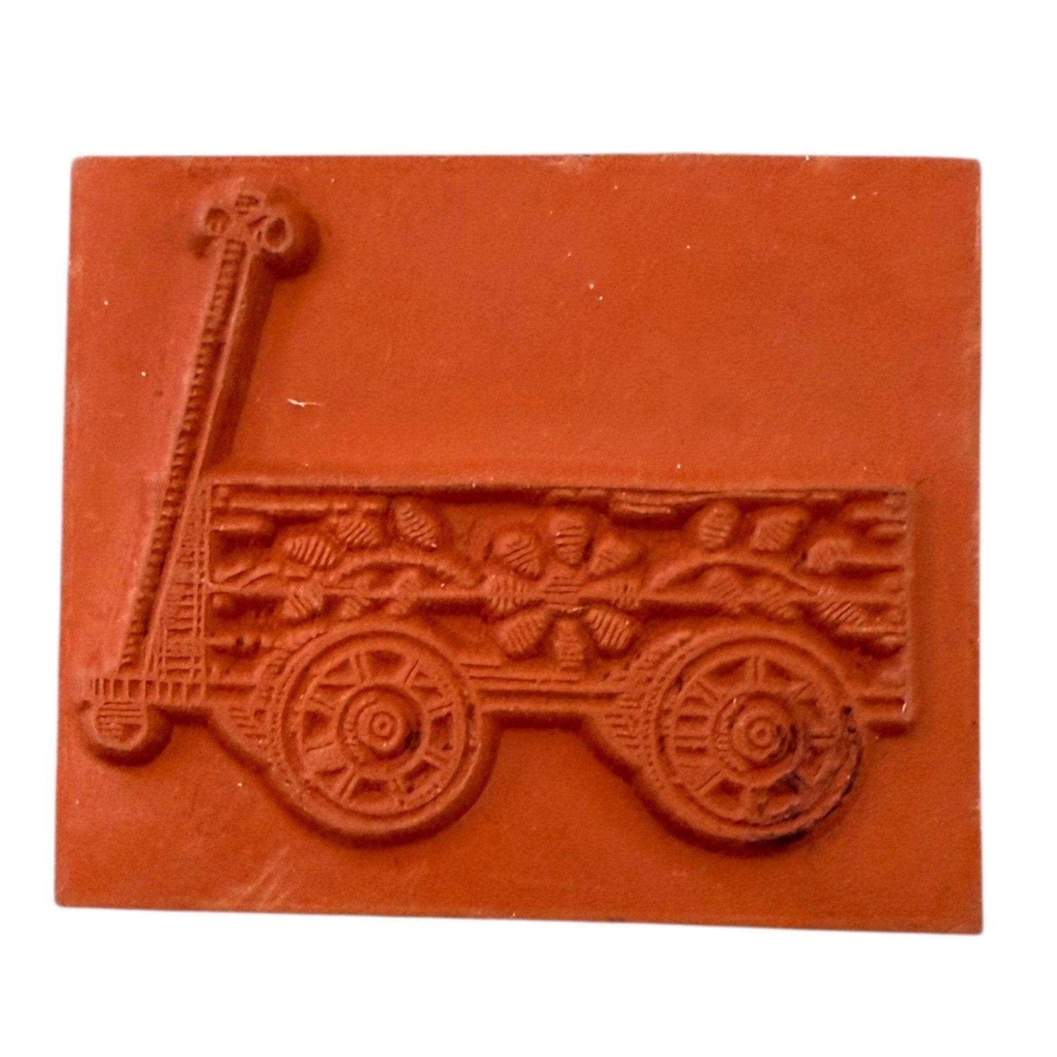 Rubber stamp of a cart with wheels on a white background