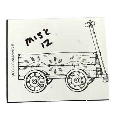 Stamp with a design of a wooden cart and 'misc 12' text on a white background