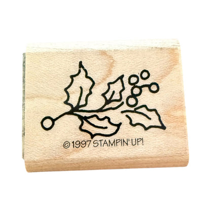 Stampin Up Holly leaf with berries on a wood block with a white background. 