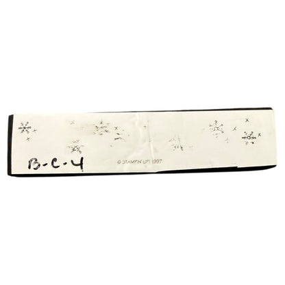 Rectangular stamp with snowflake designs and text on a white background