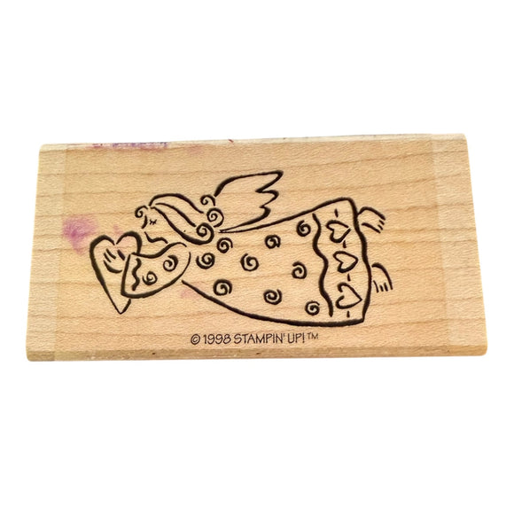 Wooden stamp with a angel design on a white background