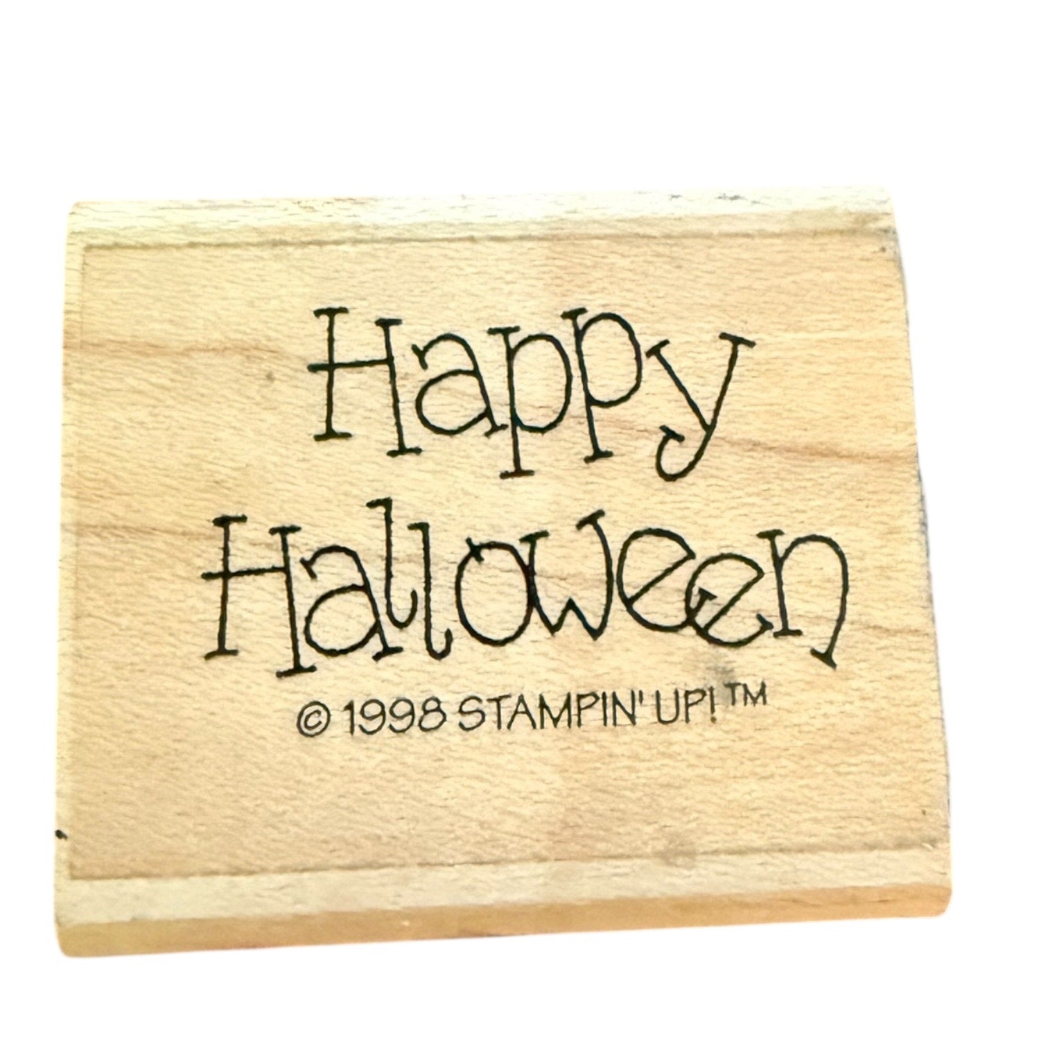 Wooden stamp with 'Happy Halloween' text and 'Stampin' Up!' branding on a white background