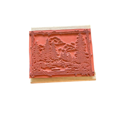 Decorative wooden block with embossed design on a white background